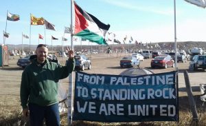 from-Palestine-to-Standing-Rock22-banner and flag-photo-cred-Haitham-AlZabri