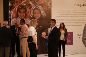 Finnish consultant Anna Helenius (left) and program participant Mohammad Shawamreh discuss a few points ahead of the program closing ceremony