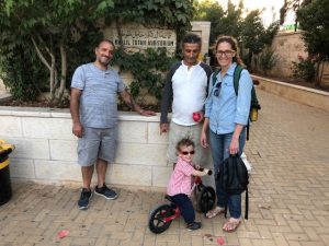 Saleh with his visiting brother and wife in front of the hall of the Friends School in Ramallah, named after their relative. Photo courtesy of the author. 