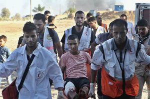 Paramedics in action during Gaza’s Great March of Return protests.