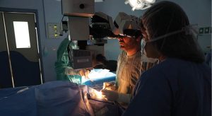 Dr. Omar and Dr. Haneen, both graduates of St John of Jerusalem Eye Hospital Group Medical Residency program, perform surgery on Bahieh, an elderly woman from the West Bank, in June 2018.