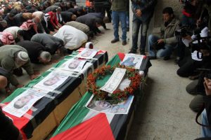 Bethlehem, March 2, 2014. Prayer over the bodies of Ayat al-Akhras and Daoud Abu Sway after the liberation of their corpses from the “cemeteries of numbers” after having been detained for decades.