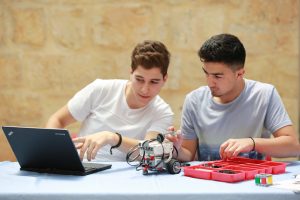 Robotics and Coding program: Al Nayzak students building robots and coding at Al Nayzak Innovation Labs.