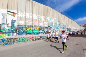 Running by the apartheid Wall. Photo courtesy of enjoybethlehem.com