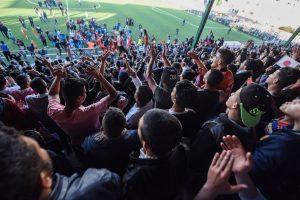 The crowds cheering at the final Tokyo League 3 match in Gaza.