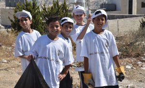 Children of Bethlehem cleaning a public street, as part of Bethlehem Clean, Bethlehem Green awareness campaign. Photo by Fadi Ghattas (Public Relations Department, Bethlehem Municipality)..