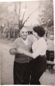 Juan Elías dancing with his grandchild Sara Elías.