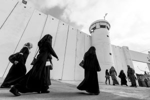 Palestinian Muslim women crossing the Bethlehem Checkpoint as they go to pray in Al-Aqsa Mosque in Jerusalem during Ramadan.