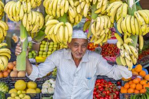 A Palestinian elder in front of his fruit and vegetable shop in Jericho.