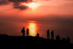 International and Palestinian hikers reaching the Dead Sea view after a sunrise hike with Masar Ibrahim Al-Khalil.